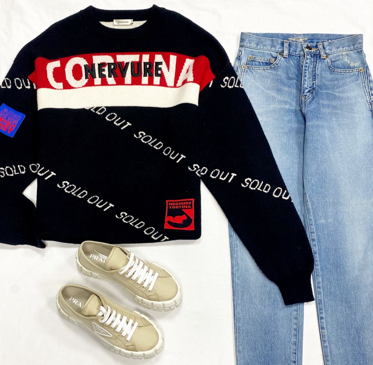 Свитер Hervure размер M цена 23 483 руб
Джинсы Saint Laurent размер 25 цена 15 655 руб
Кеды Prada размер 40 цена 39 138 руб