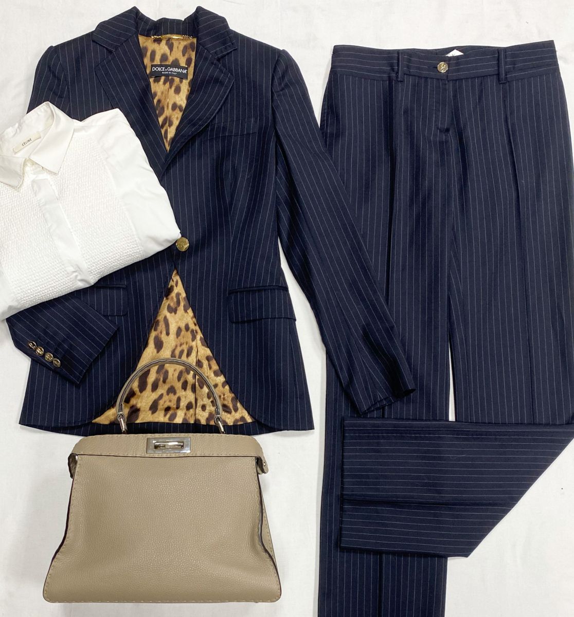 Костюм Dolce Gabbana размер 38 цена 23 483 руб
Рубашка Celine размер 40 цена 15 655 руб
Сумка Fendi 