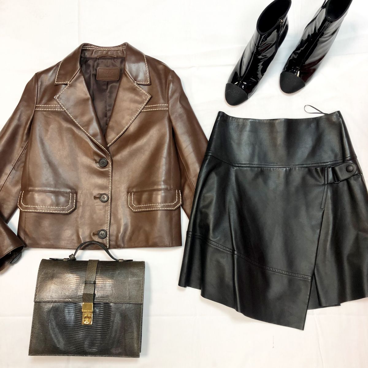 Жакет /кожа/ PRADA размер 40 цена 76 925 руб 
Юбка /кожа/ Louis Vuitton размер 36 цена 53 847 руб 
Ботильоны Chanel размер 40 цена 30 770 руб