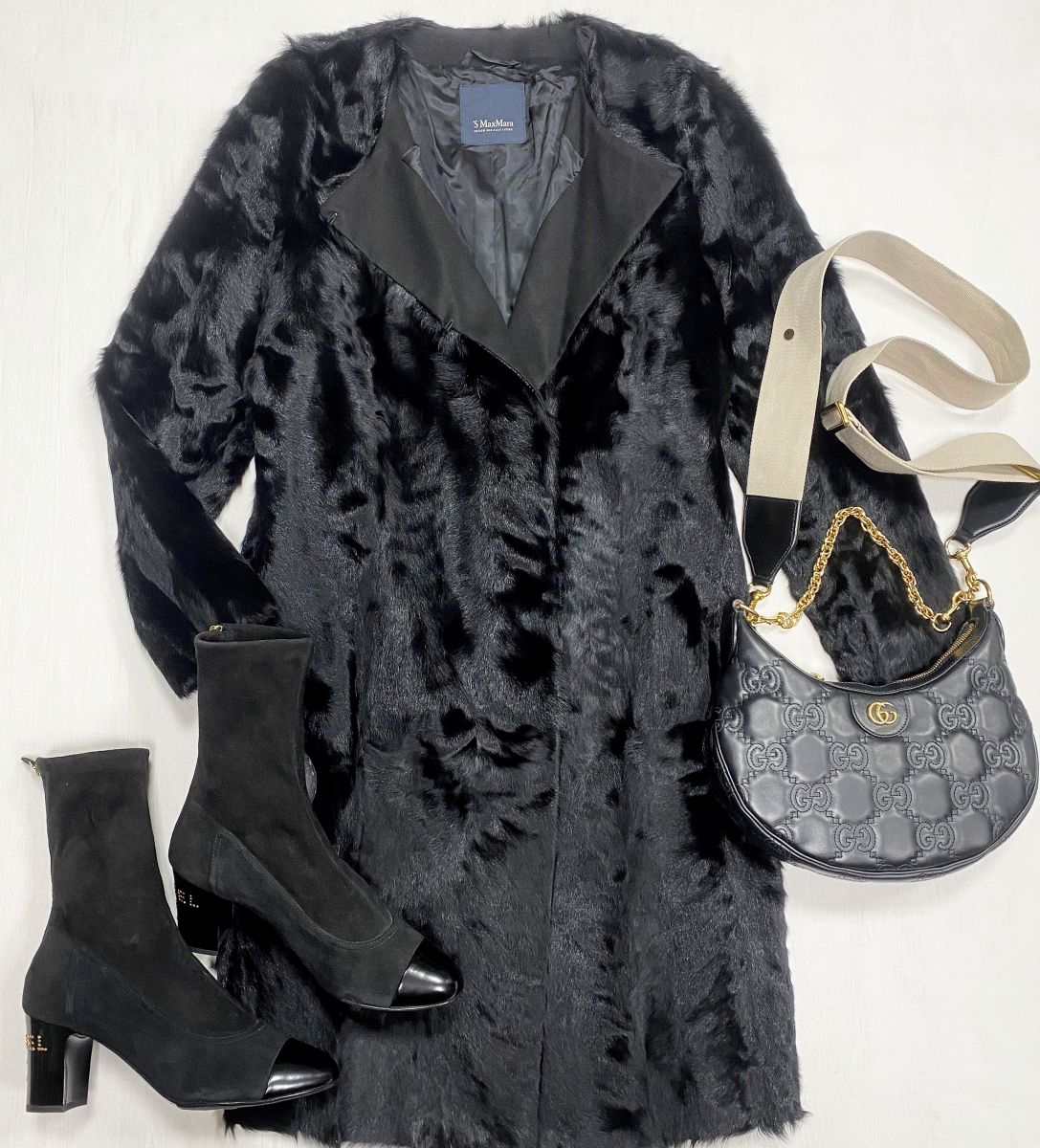 Пальто / мех козлика / S’Max Mara размер 46 цена 93 930 руб 
Ботильоны Chanel размер 40 цена 109 585 руб
Сумка Gucci