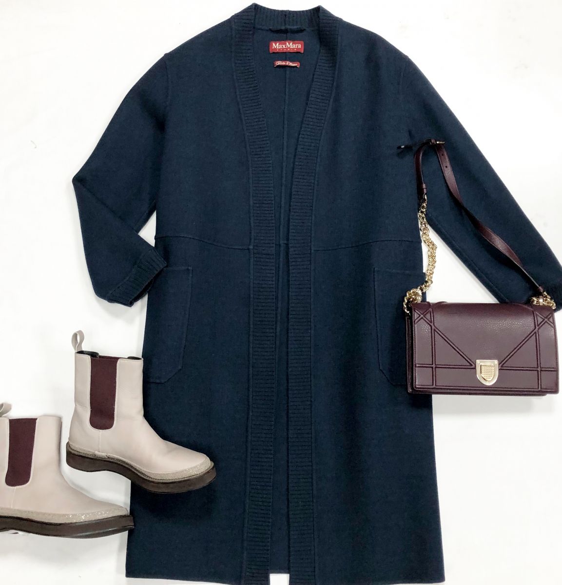 Пальто Max Mara размер 44 цена 30 770 руб
Ботинки Brunello Cucinelli размер 36 цена 30 770 руб
Сумка Christian Dior