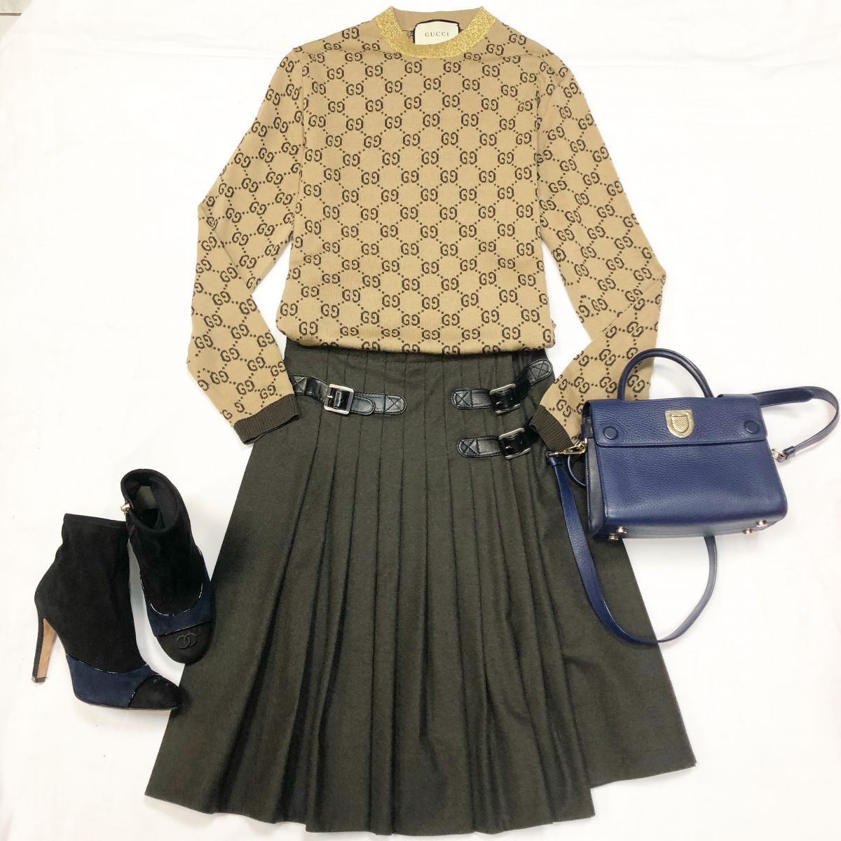 Свитер GUCCI размер М цена 18 462 руб Юбка GUCCI размер 40 цена 15 385 руб Ботильоны CHANEL размер 37 цена 27 693 руб Сумка CHRISTIAN DIOR