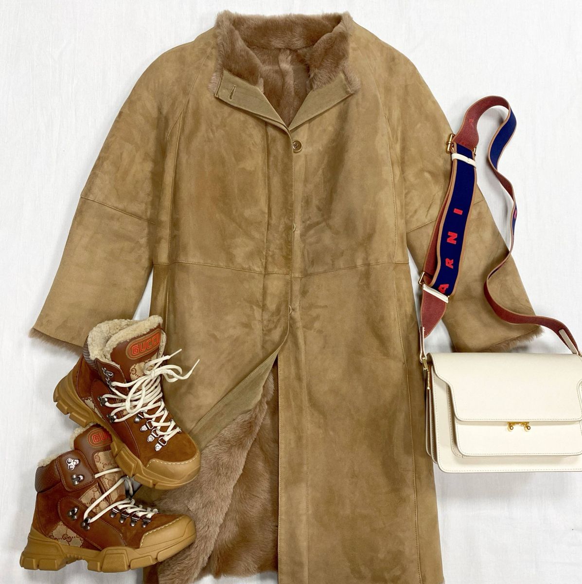 Дубленка Ermanno Scervino размер 44 цена 46 965 руб 
Ботинки Gucci размер 37.5 цена 39 138 руб 
Сумка Marni