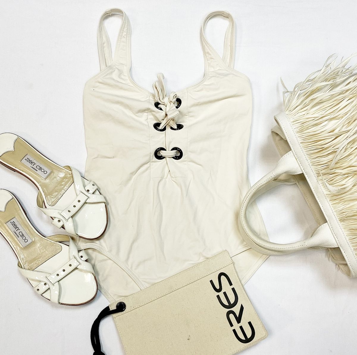 Купальник Eres размер 46 цена 9 231 рубСабо Jimmy Choo размер 38.5 цена 9 231 рубСумка Prada