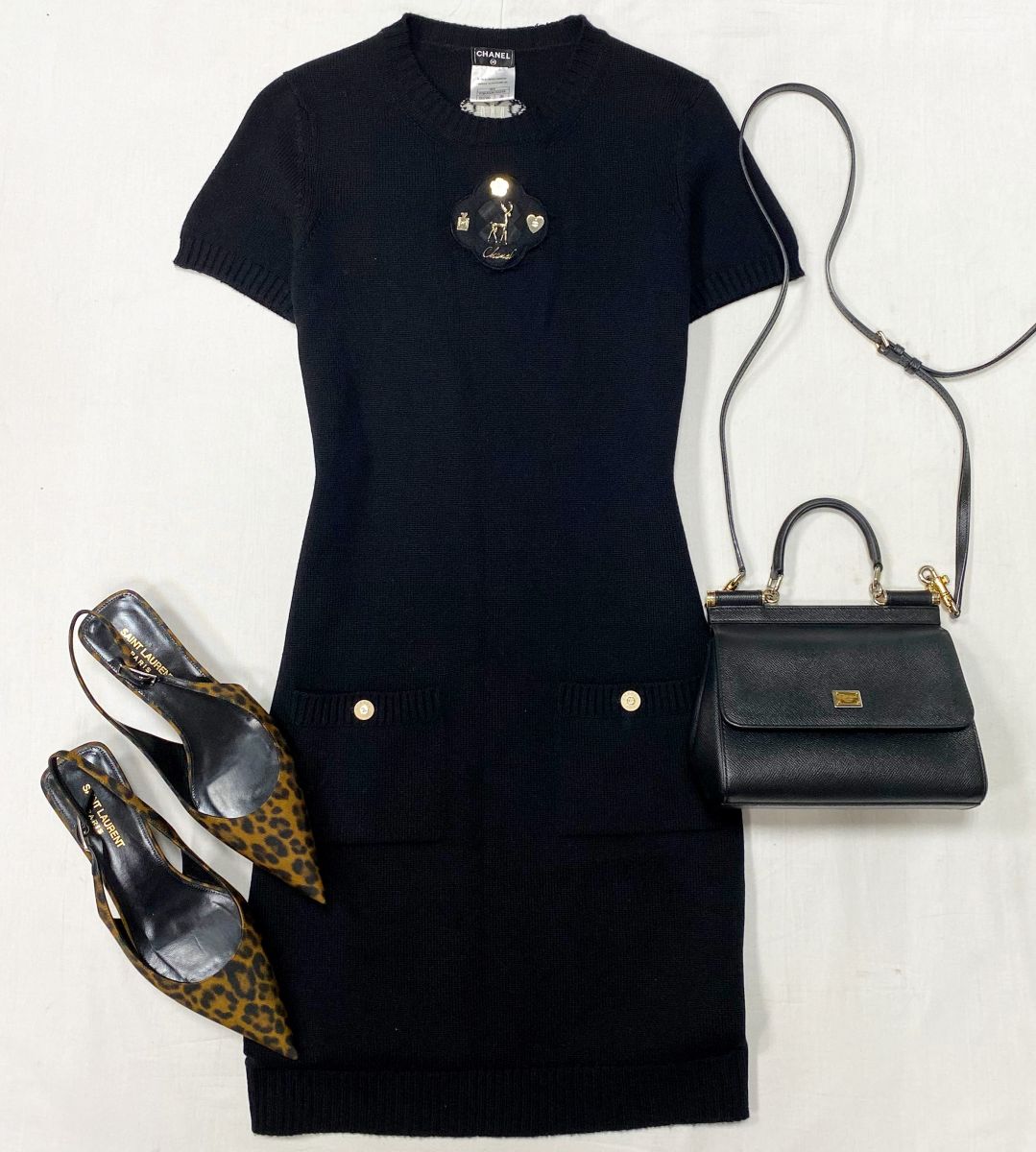 Платье Chanel размер 36 цена 31 310 руб 
Босоножки Saint Laurent размер 39 цена 39 138 руб 
Сумка Dolce Gabbana