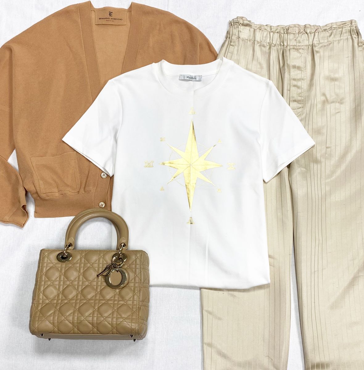 Кофта- Кардиган Ermanno Scervino размер S цена 15 655 руб
Брюки Saint Laurent размер 48 цена 23 483 руб
Футболка Max Mara размер 42 цена 9 393 руб
Сумка Christian Dior 