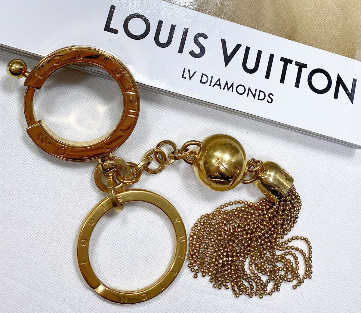 Брелок Louis Vuitton цена 15 655 руб