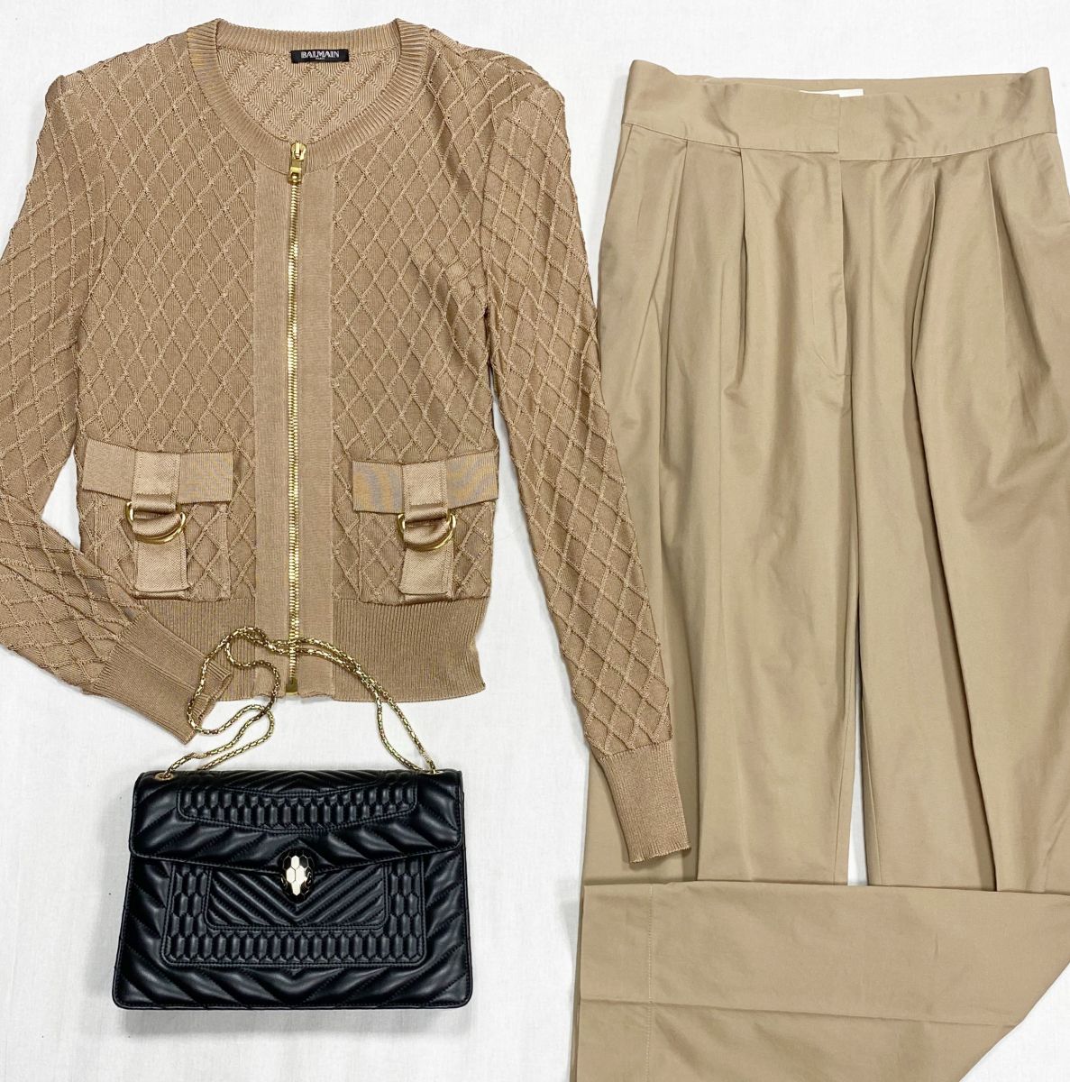 Кофта Balmain размер 38 цена 10 959 руб
Брюки TOVE размер 40 цена 6 262 руб
Сумка Bvlgari 